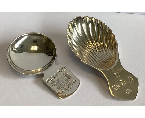 A heavy commemorative silver caddy spoon. Birmingham. Together with another silver caddy spoon. Various dates and makers. App