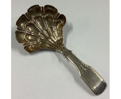 A Georgian silver caddy spoon with fluted bowl. Birmingham 1831. By JL. Approx. 8 grams.