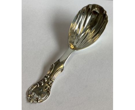 EXETER: A heavy silver caddy spoon with fluted bowl. By WRS. Approx. 15 grams. 