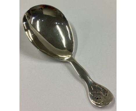 EXETER: A Victorian silver caddy spoon with leaf decoration. Approx. 11 grams.