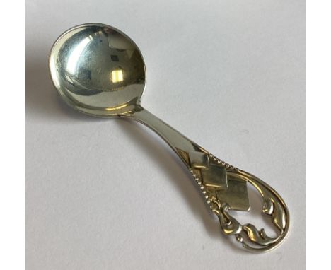 A Continental silver caddy spoon of stylised form. Approx. 16 grams.
