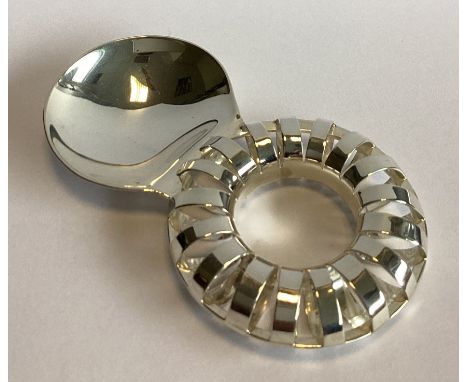 A stylish pierced silver caddy spoon of circular form. London 2020. By Karina Gill. Approx. 29 grams.