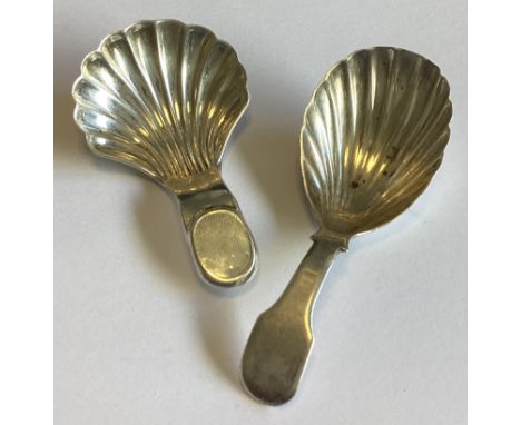 A Georgian silver caddy spoon together with another similar example. Various dates and makers. Approx. 21 grams.