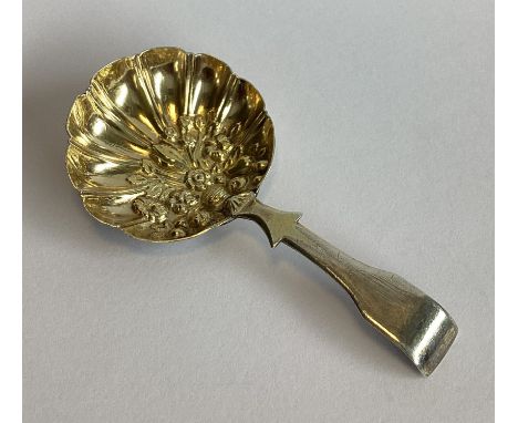 A Georgian silver caddy spoon with chased decoration to gilt bowl. Birmingham. By L&C. Approx. 8 grams.