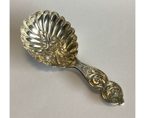 An attractive chased Victorian silver caddy spoon with fluted bowl. Birmingham 1851. By CW&Co. Approx. 11 grams.