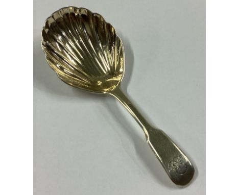 A Georgian silver fiddle pattern caddy spoon with gilt decoration. London 1808. By IB. Approx. 14 grams.