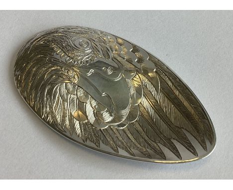 EDINBURGH: An unusual engraved silver eagle's wing caddy spoon of oval shape and of concave and convex form. By Malcolm Apple