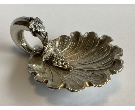 A fine frosted silver caddy scoop with fluted bowl to vine decoration. Birmingham 1858. By George Unite. Approx. 18 grams.