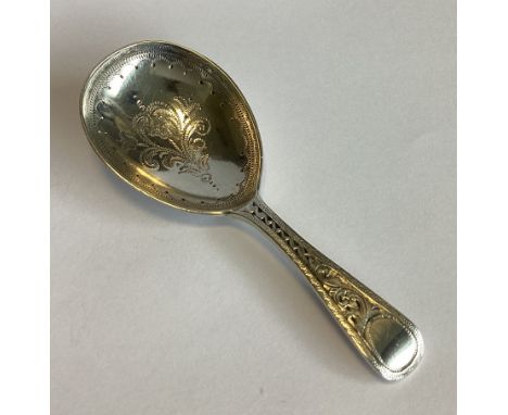 A good Victorian silver caddy spoon with bright-cut floral decoration. London 1877. By HL Ltd. Approx. 17 grams.