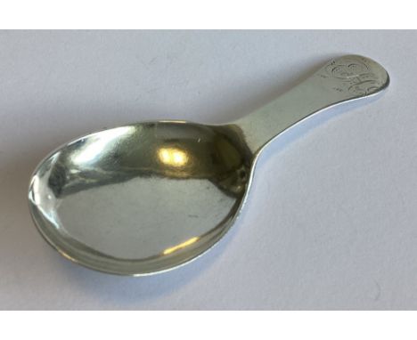 An Antique silver caddy spoon of plain form. Apparently unmarked. Approx. 19 grams.