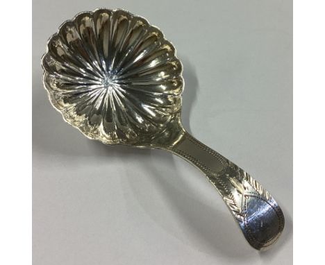 A Georgian silver feather edge caddy spoon. London 1798. By TW. Approx. 6 grams.