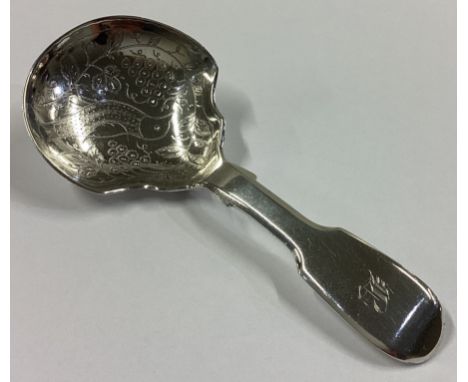 An attractive silver fiddle pattern caddy spoon engraved with bird decoration. London. By WJ. Approx. 23 grams.