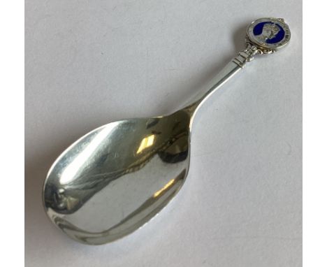 A commemorative silver and enamelled caddy spoon. Birmingham 1936. By WHH. Approx. 14 grams.