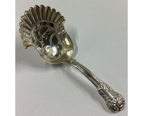 A large silver caddy spoon with bright-cut and fluted decoration. Birmingham. By IT. Approx. 9 grams.