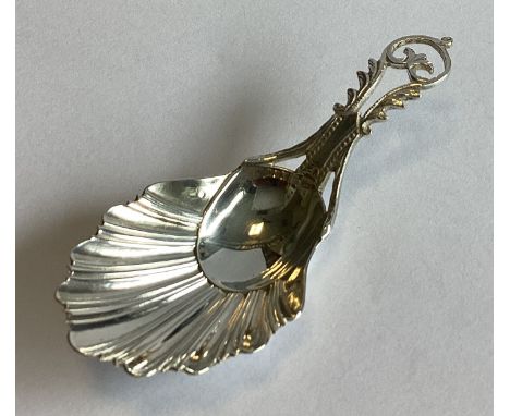 A heavy cast silver caddy spoon with fluted bowl to pierced handle. Sheffield. By TBS. Approx. 17 grams.