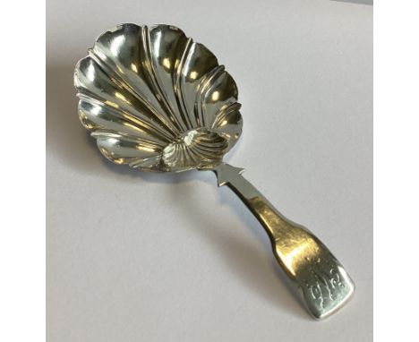 A good Georgian silver fiddle pattern caddy spoon with fluted shell bowl. London. By WW. Approx. 11 grams.
