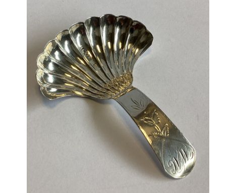 A large Georgian silver caddy spoon with fluted bowl to bright-cut handle. Birmingham. Approx. 13 grams.
