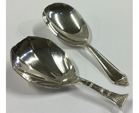Two heavy Modernistic silver caddy spoons. Various dates and makers. Approx. 32 grams.