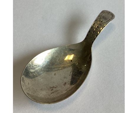 A silver caddy scoop with bright-cut decoration. London. Approx. 6 grams.
