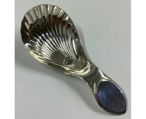 A good Georgian silver fluted caddy spoon with plain thumbpiece. Sheffield. By IP&Co. Approx. 10 grams.