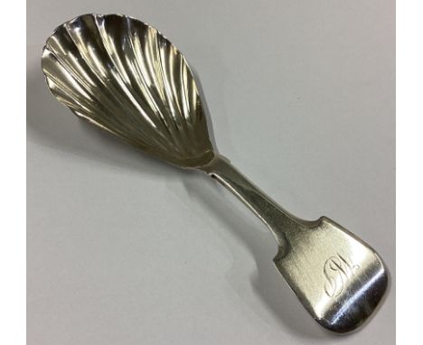 A Scottish Provincial silver fiddle pattern caddy spoon with fluted bowl. Punched verso. By PR. Approx. 10 grams.