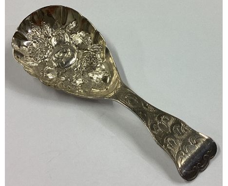 An attractive Victorian silver caddy spoon with chased decoration. Birmingham 1867. By George Unite. Approx. 13 grams.