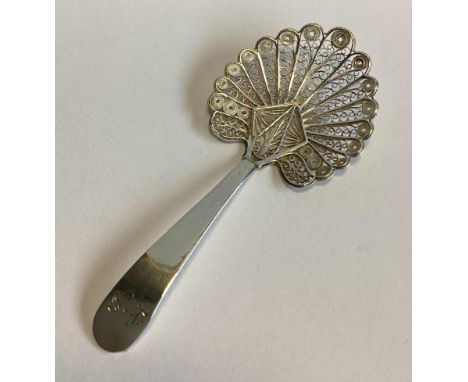 A good Georgian silver filigree caddy spoon with plain handle. London. Approx. 9 grams.