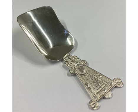 DUBLIN: An unusual Irish silver caddy scoop of shaped form. By JMC. Approx. 18 grams.