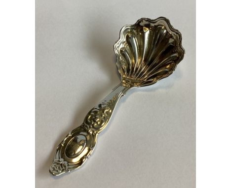 A good quality chased Victorian silver caddy scoop with fluted bowl. London 1860. Approx. 25 grams.