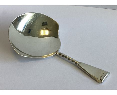 A silver scroll back caddy spoon in the Georgian style. Birmingham. By George Unite. Approx. 13 grams.