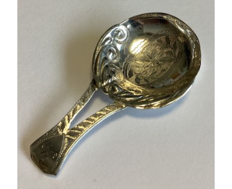 A good Georgian silver caddy spoon with chased floral decoration. Birmingham 1813. By JL. Approx. 5 grams.