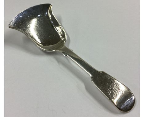 NEWCASTLE: A large silver fiddle pattern caddy scoop. By TW. Approx. 15 grams.