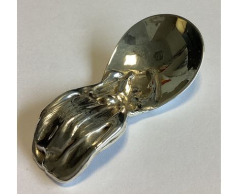 A heavy silver caddy spoon of stylised form with textured handle. London. By JD. Approx. 47 grams.