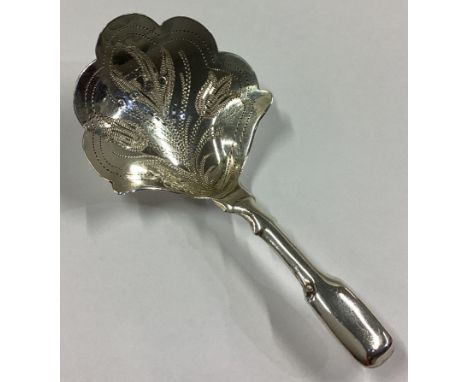 An attractive shaped Victorian silver caddy spoon decorated with flowers and leaves. Birmingham 1865. By Hilliard & Thomason.
