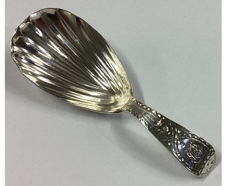 A heavy Georgian silver caddy spoon with fluted bowl. London 1831. By IP. Approx. 10 grams.