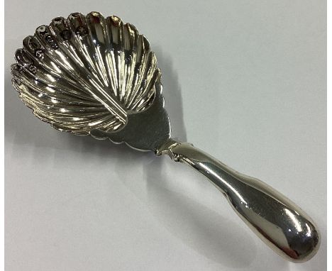 An unusual fluted silver caddy spoon with plain handle. Birmingham 1816. By Cocks & Betteridge. Approx. 6 grams.