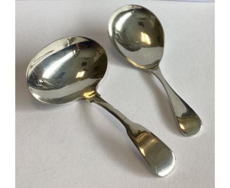 A heavy silver OE pattern caddy spoon. Sheffield. By Walker & Hall. Together with another similar example. Approx. 32 grams.
