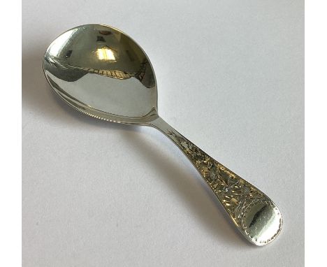 A large silver caddy spoon with bright-cut decoration. Sheffield. By JJ. Approx. 22 grams.