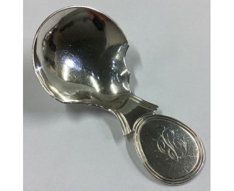 A heavy Georgian silver caddy spoon with oval thumbpiece. Birmingham 1822. By Joseph Wilmore. Approx. 22 grams.