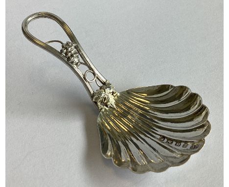 An attractive Victorian silver caddy spoon with vine decoration. Birmingham 1866. By George Unite. Approx. 8 grams.