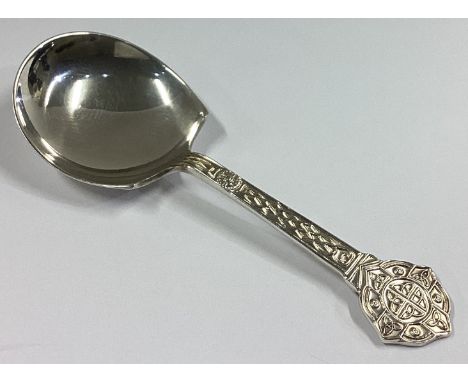 A chased silver caddy spoon of tapering form. Sheffield. By CB&S. Approx. 15 grams.