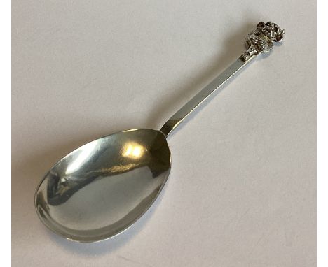 An unusual silver caddy spoon with Lincoln Imp finial. Birmingham 1908. By LJ. Approx. 15 grams.