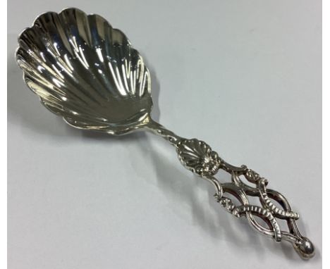 An attractive late Victorian silver caddy spoon with pierced handle to fluted bowl. London. By GJ&DF. Approx. 14 grams.