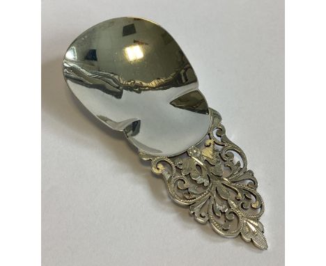 A large silver caddy scoop decorated with scrolls. Sheffield 1897. By Mappin & Webb. Approx. 35 grams.