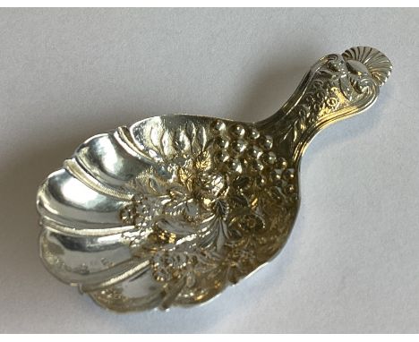 A good quality cast silver caddy spoon decorated with flowers and leaves. Birmingham. By Joseph Wilmore. Approx. 13 grams.