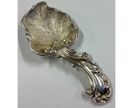 A Victorian silver caddy spoon with chased handle and engraved bowl. Sheffield 1847. By AH. Approx. 13 grams.