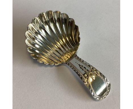 A good Georgian silver caddy spoon with bright-cut handle to fluted bowl. London 1785. By JI. Approx. 11 grams.