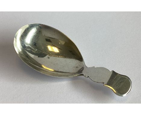 A Georgian silver caddy spoon with shaped handle. Birmingham 1859. By TJ. Approx. 13 grams.