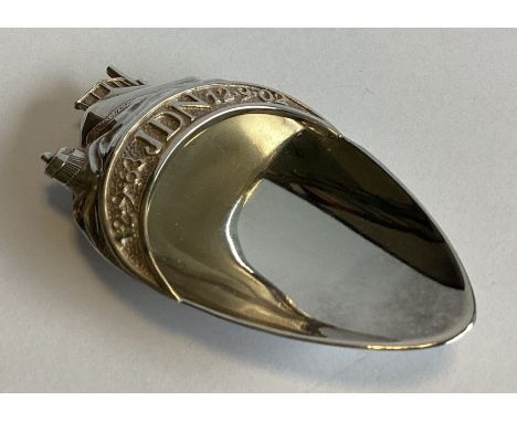 An unusual Britannia Standard silver caddy scoop decorated with a tug boat in rough seas. By Michael Softly. Approx. 33 grams