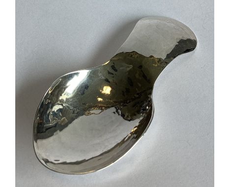 GUILD OF HANDICRAFTS: A large textured silver caddy spoon. London 1982. Approx. 27 grams.
